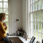 Common Side Effects of Birth Control Hero Image Image of a woman looking out a window considering birth control options