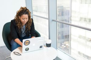 Woman checking insurance benefits on a laptop