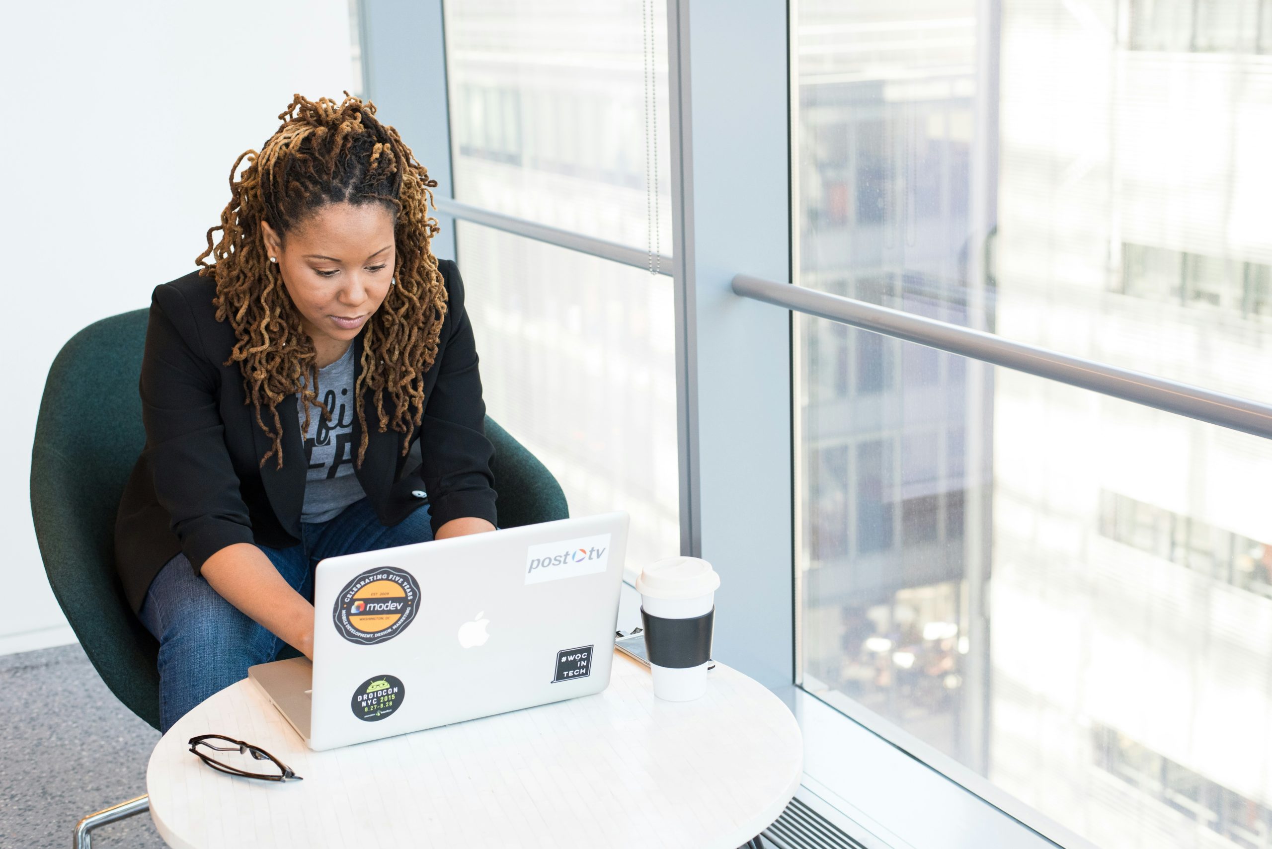 Woman checking insurance benefits on a laptop